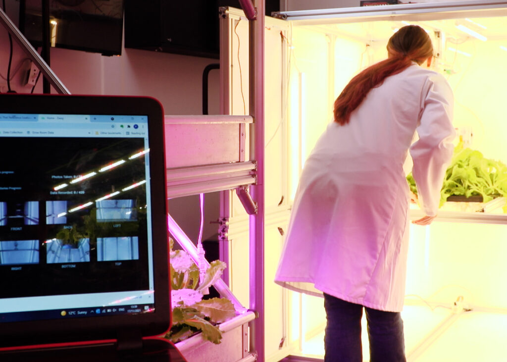 Crop samples are placed in a photo chamber to allow analysis of growth issues and to feed the machine learning process.